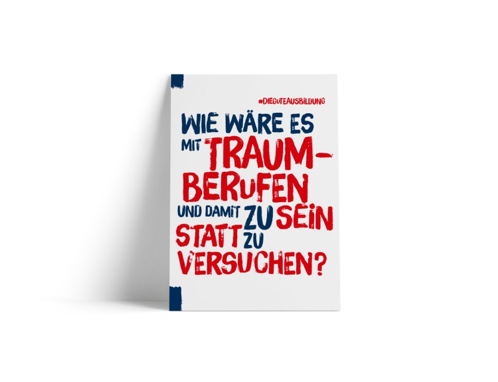 Ein weißes Plakat mit fettgedrucktem blauem und rotem Text in deutscher Sprache, auf dem steht: „Wie wäre es mit Traumberufen und damit, einfach dabei zu sein, statt es zu versuchen?“ Das Plakat ist an der oberen linken und unteren rechten Ecke eingekerbt.